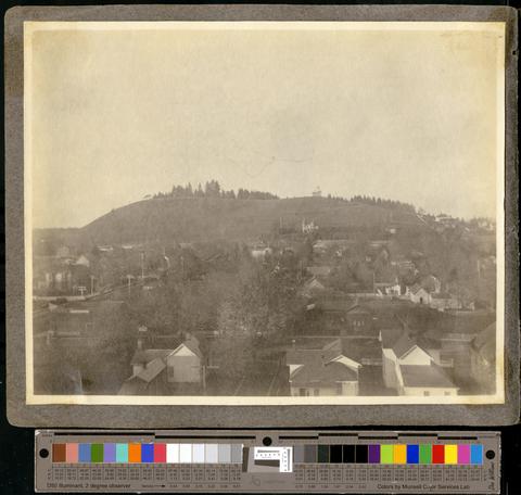 View from a tall building, across Eugene to Skinner's Butte, Shelton-McMurphey house, and UO Observatory, before 1909, when the "O" was installed, c. 1901 show page link
