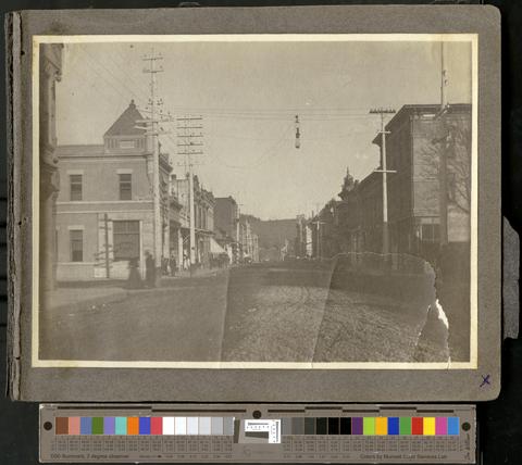 View up Willamette Street to Skinner's Butte, prior to paving and trolley line, with First National Bank at left, c. 1901 show page link
