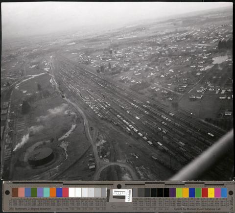 Aerial photo of Eugene area showing train tracks and freight cars., c. 1960s [b001] [175] show page link